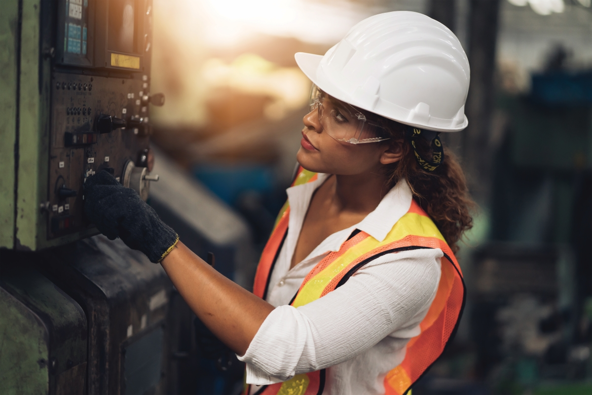 woman in construction gear rotating dials